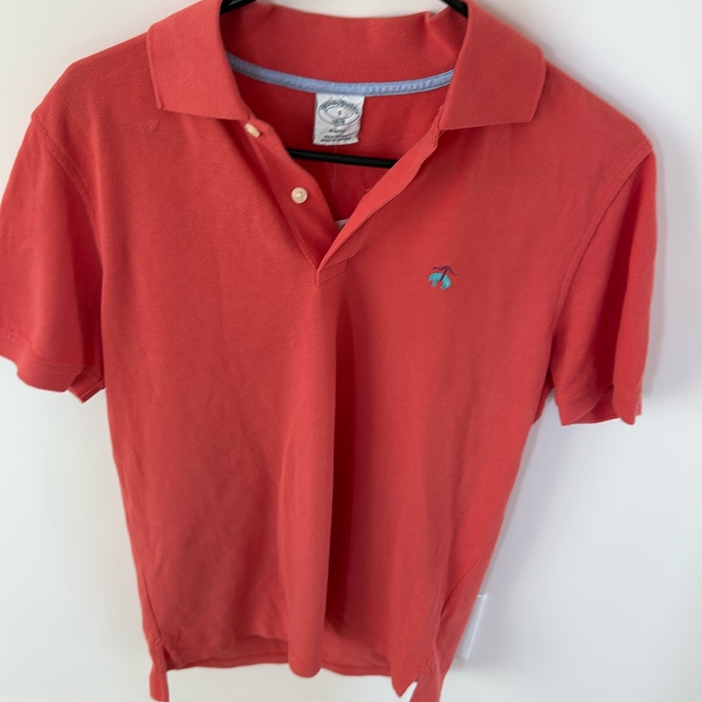 Brooks Brothers slim fit polo shirt new w/tags. Color pink/peach. Size small.